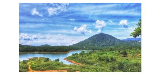 Scenic view of landscape and mountains against sky