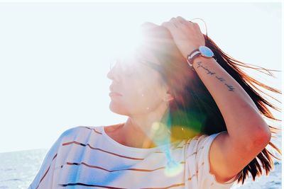 Portrait of woman against clear sky