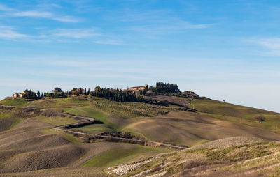 Scenic view of agricultural field against sky