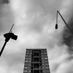 Low angle view of street light against building