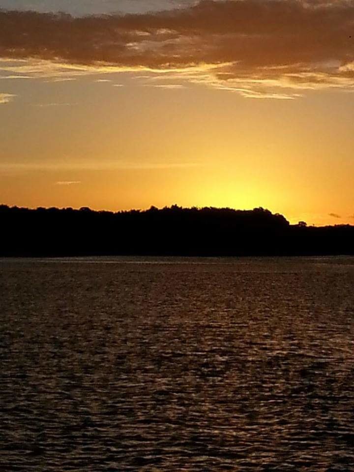 SCENIC VIEW OF SUNSET OVER SEA