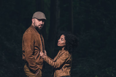 Young couple looking at camera