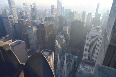 High angle view of buildings in city against sky