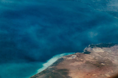 Scenic view of sea against blue sky