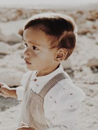 Profile portrait of a kid walking in the desert