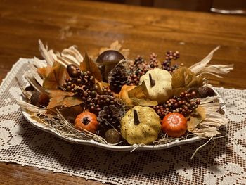 High angle view of autumn decorations in plate on table