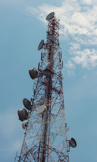 Low angle view of telephone pole against sky