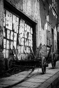 Bicycle parked against building