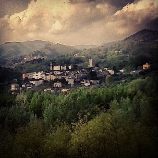 VILLAGE IN CITY AGAINST SKY