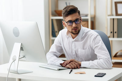 Businesswoman working at desk in office