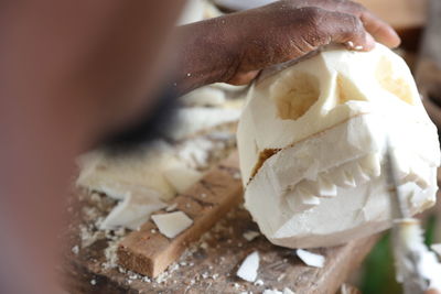 Close-up of hand holding ice cream