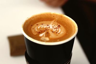 Close-up of cappuccino on table