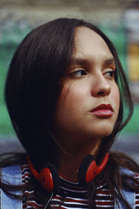 Close-up of teenage girl with headphones