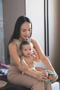 Portrait of cute girl sitting at home