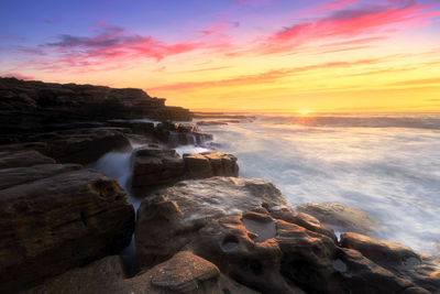 Scenic view of sea against sky during sunset