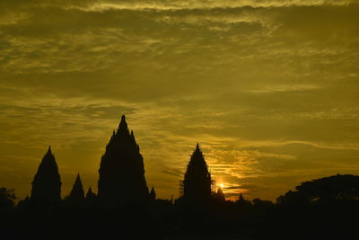 Silhouette temple against sky during sunset