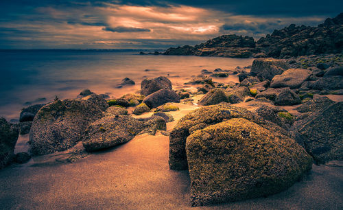 Scenic view of sea against sky at sunset