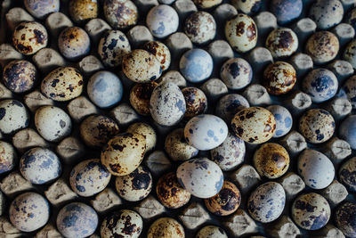 Full frame shot of quail eggs in crate