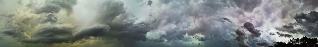 Panoramic view of waterfall against sky during rainy season