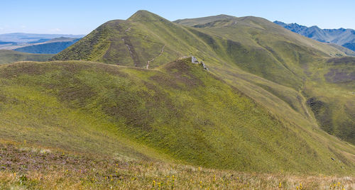 Volcanic landscape of the puys chain near puy de sancy on top of puy de la tache in summer 