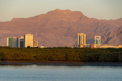 Buildings in city against sky