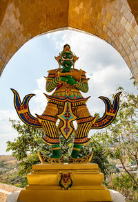 Low angle view of statue against building