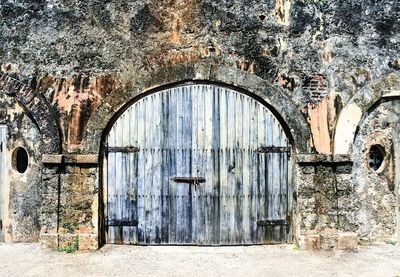 Weathered wooden door at castillo de san cristobal