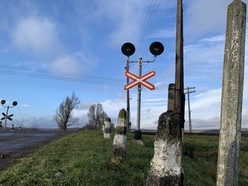Street light on field against sky
