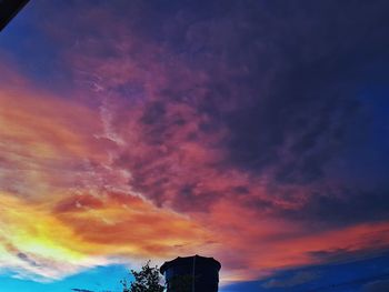 Low angle view of dramatic sky during sunset