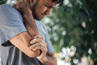 Close-up of man holding hands