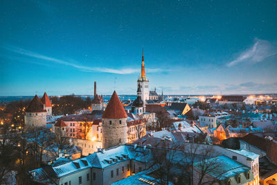 High angle view of townscape against sky at night