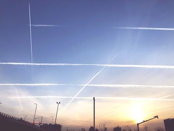 Vapor trail in sky during sunset