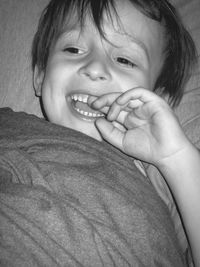 Close-up of cute boy with finger in mouth