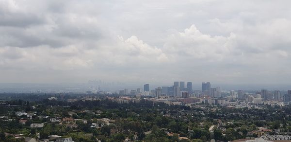 High angle view of buildings in city against sky