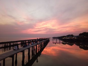 Scenic view of lake against romantic sky at sunset