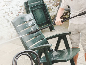 Rear view of man sitting on chair