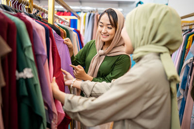 Smiling females shopping in mall