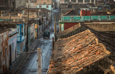 High angle view of people walking on street amidst buildings