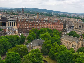 High angle view of buildings in town against sky