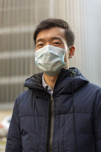 Portrait of young man standing outdoors