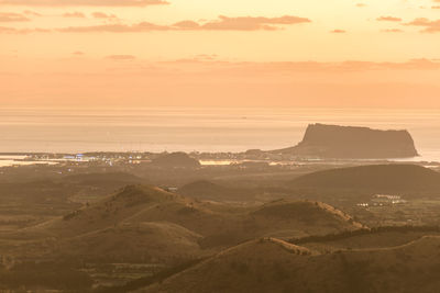 Scenic view of landscape against sky during sunset