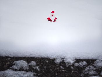 Scenic view of snow covered field against sky