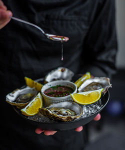 Midsection of man preparing food