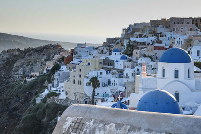 Buildings in city against clear sky. santorini