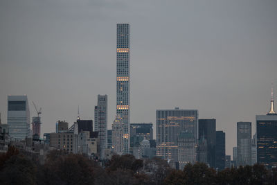 Skyscrapers in city against clear sky