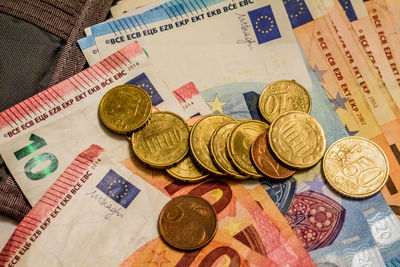 High angle view of coins on table