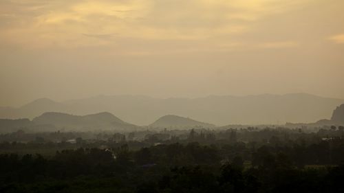 Scenic view of mountains against sky during sunset