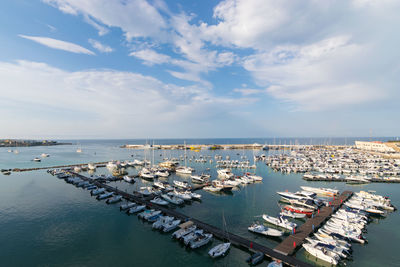 High angle view of boats moored at harbor