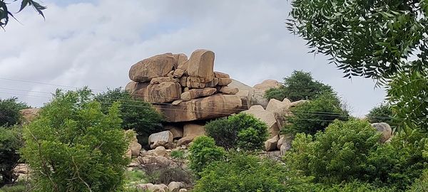 Low angle view of statue against cloudy sky