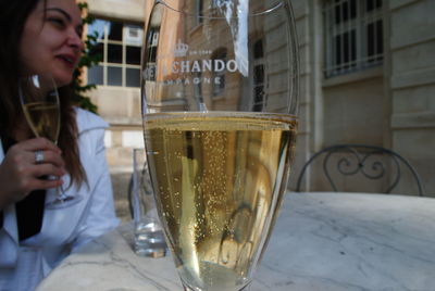 Close-up of a woman with drink in restaurant